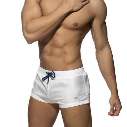 New Mens Swimming Trunks Classic Solid Color Three Point Quick Drying Swimming Trunks Low Waist Sexy Beach Surfing Sports Shorts
