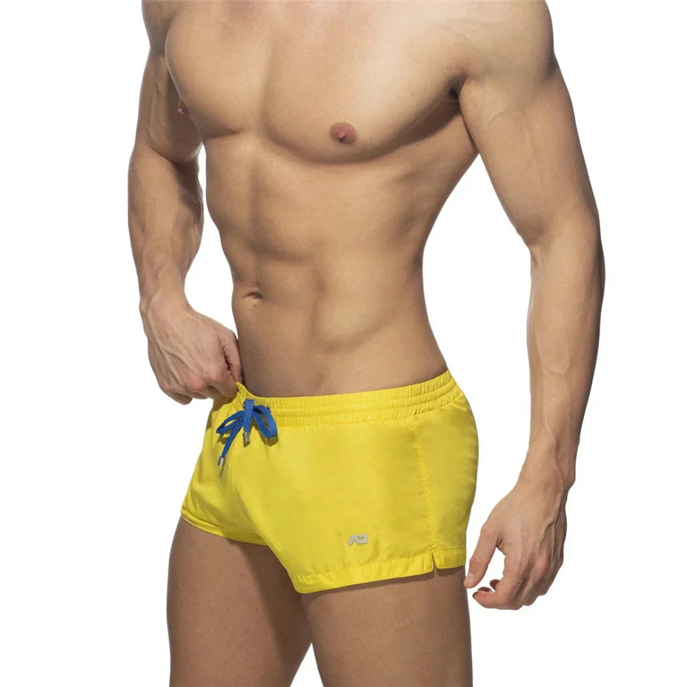 New Mens Swimming Trunks Classic Solid Color Three Point Quick Drying Swimming Trunks Low Waist Sexy Beach Surfing Sports Shorts