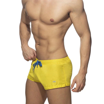 New Mens Swimming Trunks Classic Solid Color Three Point Quick Drying Swimming Trunks Low Waist Sexy Beach Surfing Sports Shorts